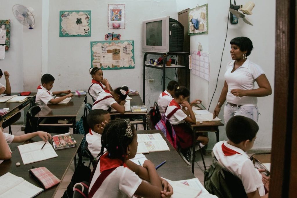 A teacher teaching a class of district school